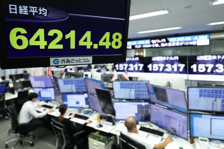 Asian stocks, currencies rise as Fed rate hike bets ease